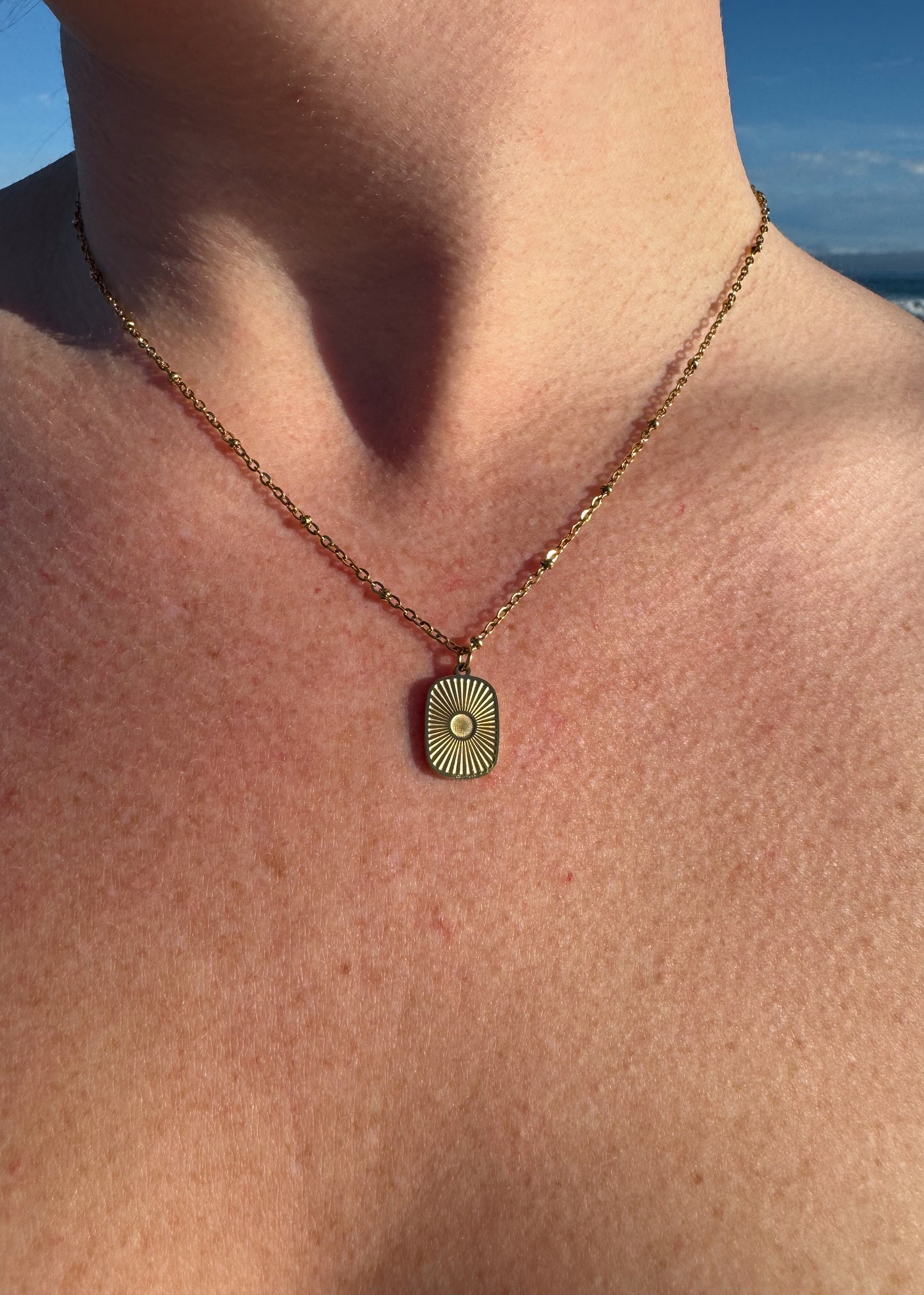 Oval Sunburst Charm